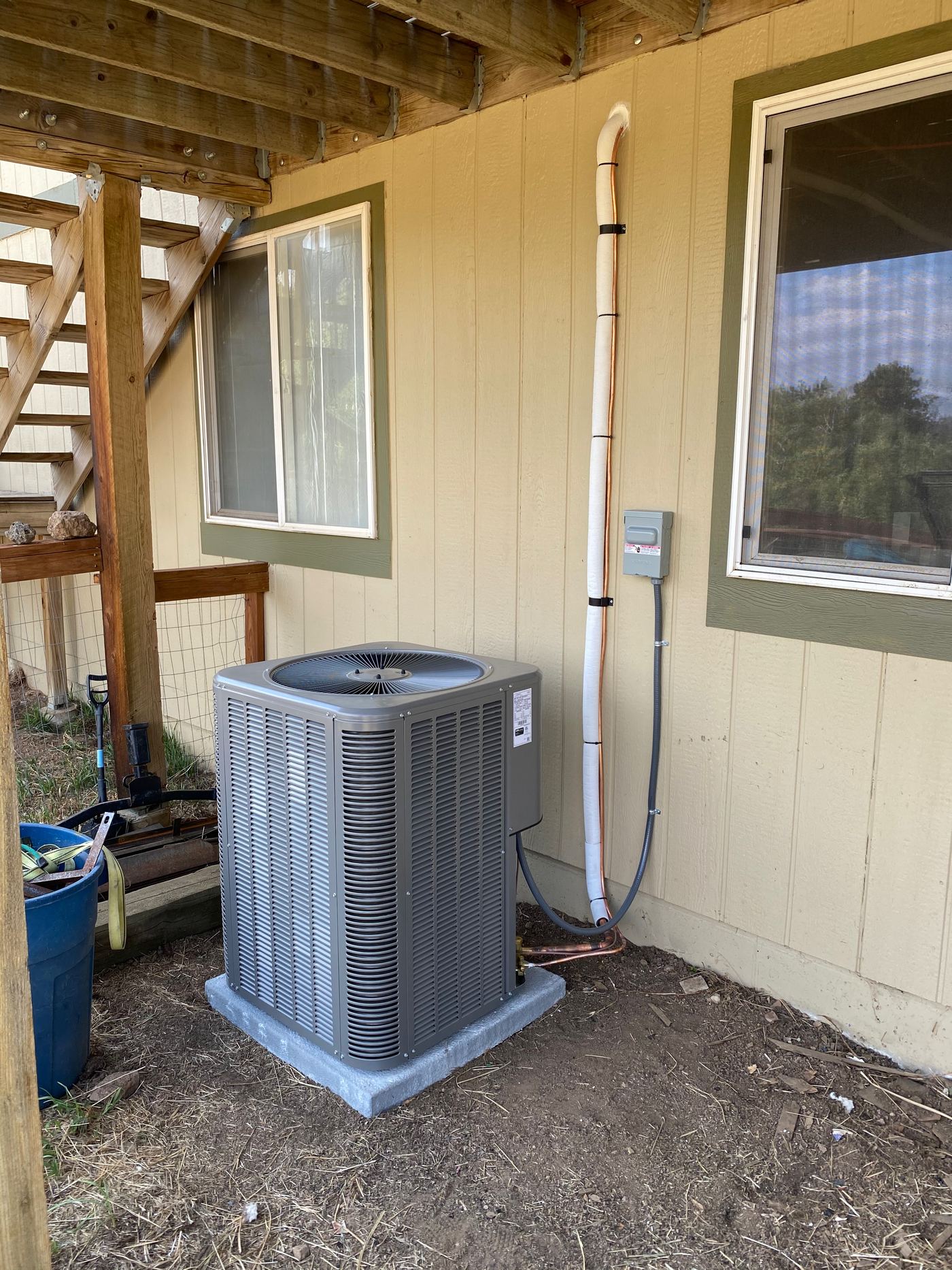 Condenser under a deck with insulated line set