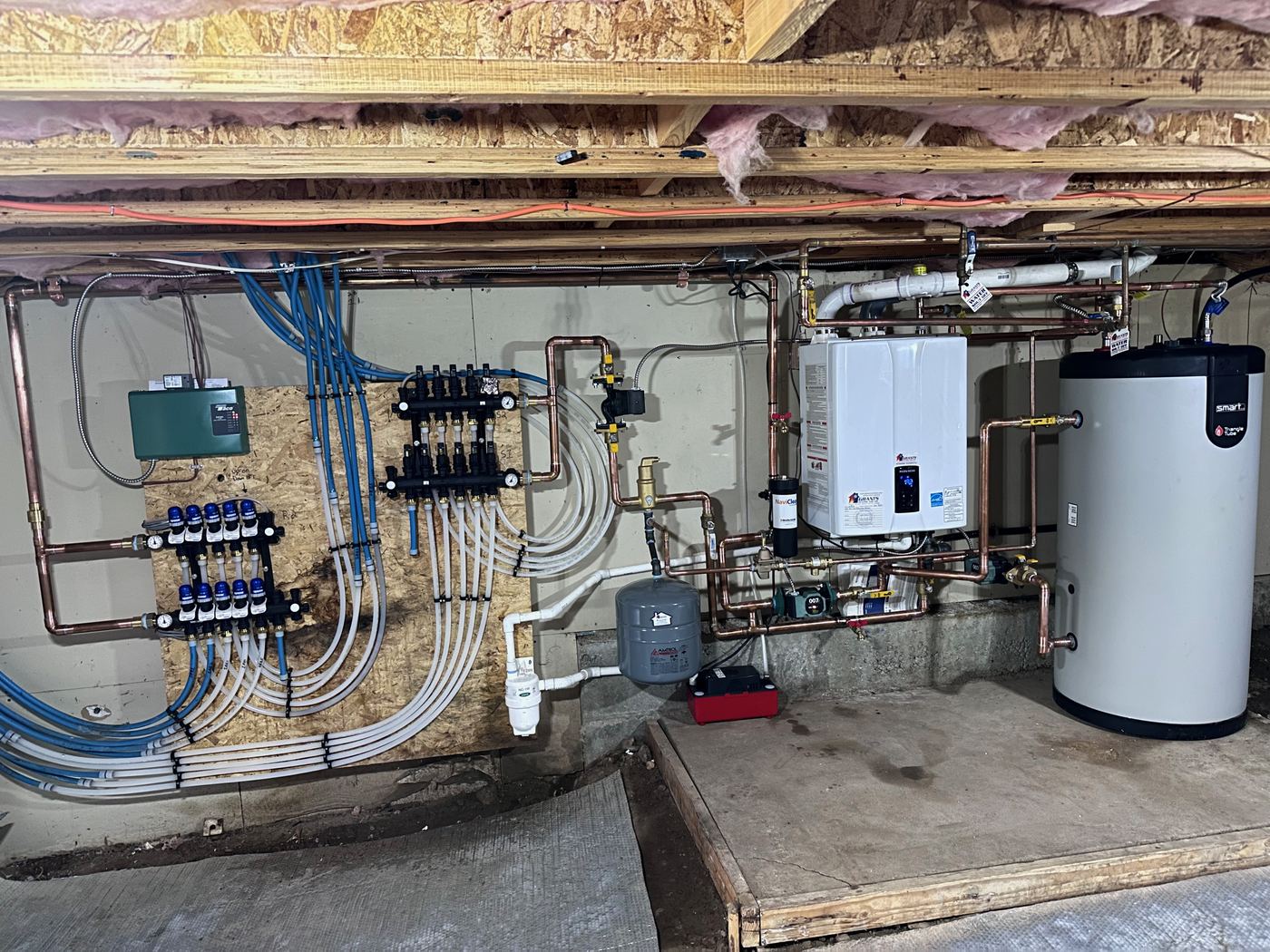 Radiant floor manifold and tankless water heater
