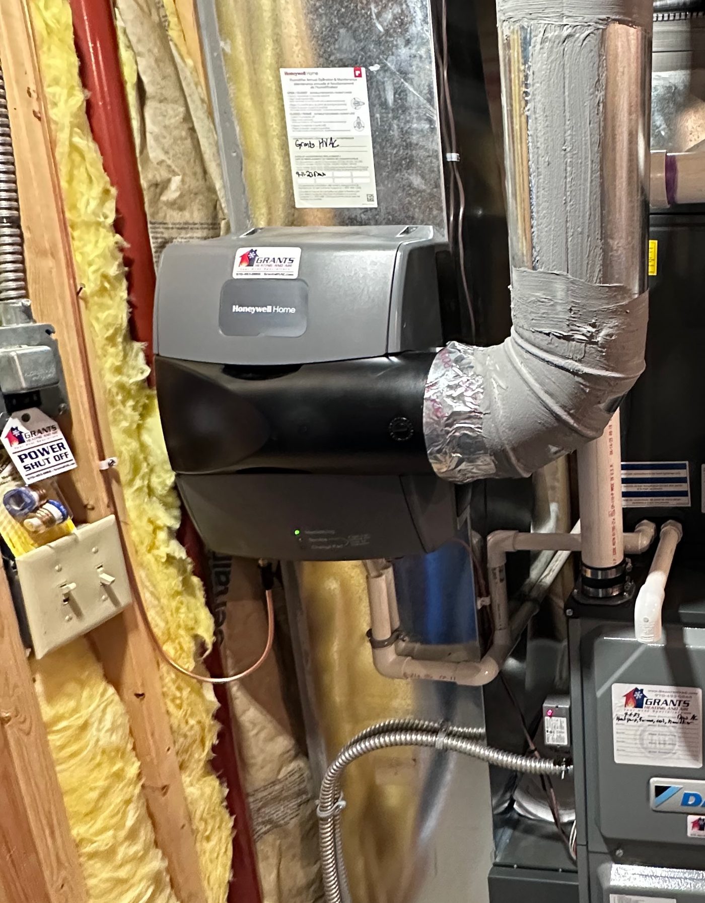 Honeywell HE300 humidifier with Grants HVAC sticker