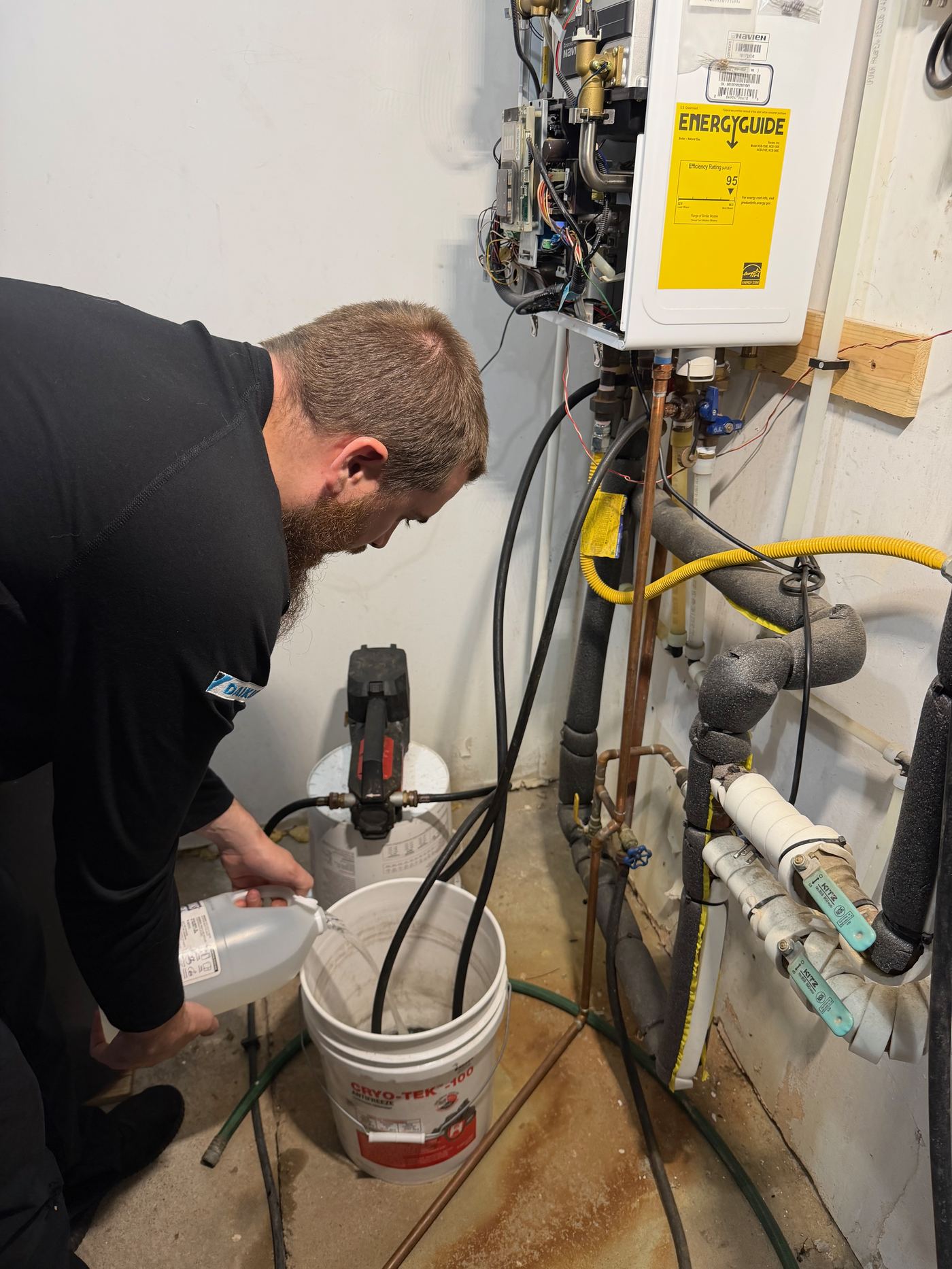 Grant flushing a Navien boiler