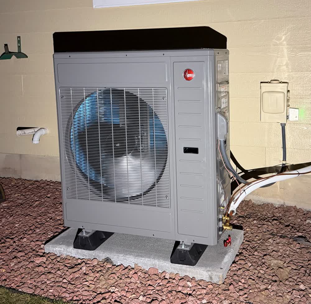 Rheem heat pump on a pad — Grants HVAC install